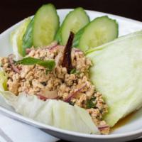 Larb Kai - Chicken Mint Lettuce Wrap · Gluten free. Thai herbs-chopped chicken-chili mint-lime dressing-lettuce cups pounded toaste...