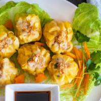 Steamed Thai Dumpling · Wonton skin stuffed with shrimp and chicken served with spicy soy sauce.