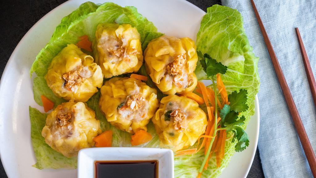 Steamed Thai Dumpling · Wonton skin stuffed with shrimp and chicken served with spicy soy sauce.