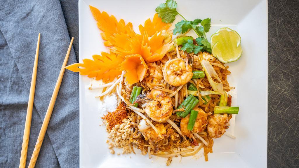Pad Thai · Stir fried rice noodles with egg, minced bean curd, bean sprout, scallion and peanut.