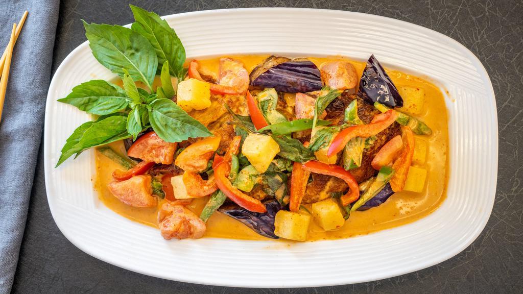 Duck Curry · Red curry with coconut milk, pineapple, tomato, sweet pea, chili pepper and fresh basil.