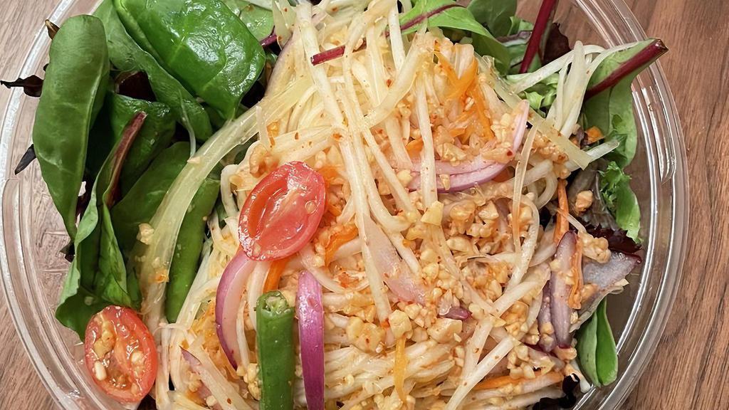 Papaya Salad · Shredded papaya, red onions, carrot, string beans, tomato, and crushed peanut in spicy lime dressing.