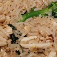 Thai Fried Rice · Fried rice, eggs, scallions, onions, tomatoes, and Asian greens.