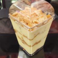 Med Banana Pudding  · Layers of vanilla custard, Nilla wafers and sliced bananas topped with  meringue and crushed...