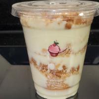 Lg Banana Pudding · Layers of vanilla custard, Nilla wafers and sliced bananas topped with  meringue and crushed...