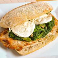 Grilled Chicken Panini · Homemade bread with grilled chicken, broccoli rabe & fresh mozzarella cheese.