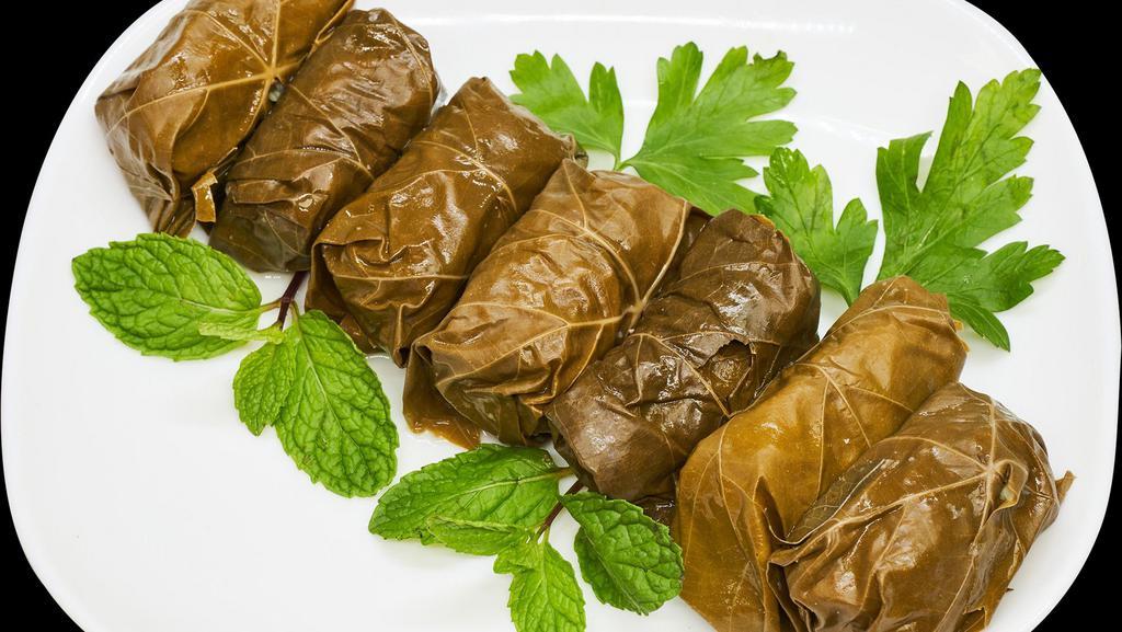 Dolma ( 7 Pieces )  · Grape leaves, beef, rice, onion, cilantro, salt, mint, coriander, and black pepper.