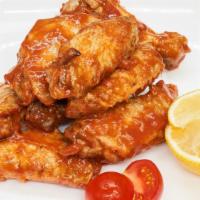Chicken Wings ( 7 Pieces ) · Jumbo wings, spices, and BBQ sauce.