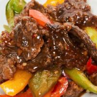 Mongolian Beef · Beef sliced into strips, garlic, bell pepper, onion, scallion, teriyaki sauce, and say sauce.
