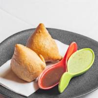 Samosa (Veg) · Crispy pastry turnover stuffed with spiced potatoes and peas.