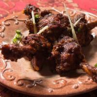 Drums Of Heaven · crispy chicken lollipops sautéed in fresh ginger, garlic and chili