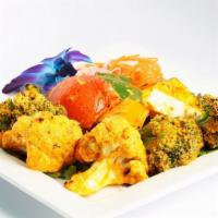 Tandoori Vegetables · Potatoes, cauliflower, paneer, mushrooms, onions, bell peppers, and tomatoes baked in tandoor.