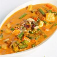 Navratan Korma · Nine jewel veggies cooked in a creamy mild sauce.
