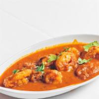 Shrimp Vindaloo · Spicy goan sauce with dry red chilies, garlic, and potatoes.