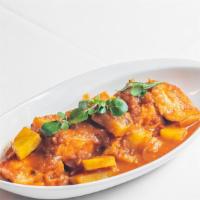 Salmon Vindaloo · Spicy Goan sauce with dry red chilies, garlic, and potatoes.