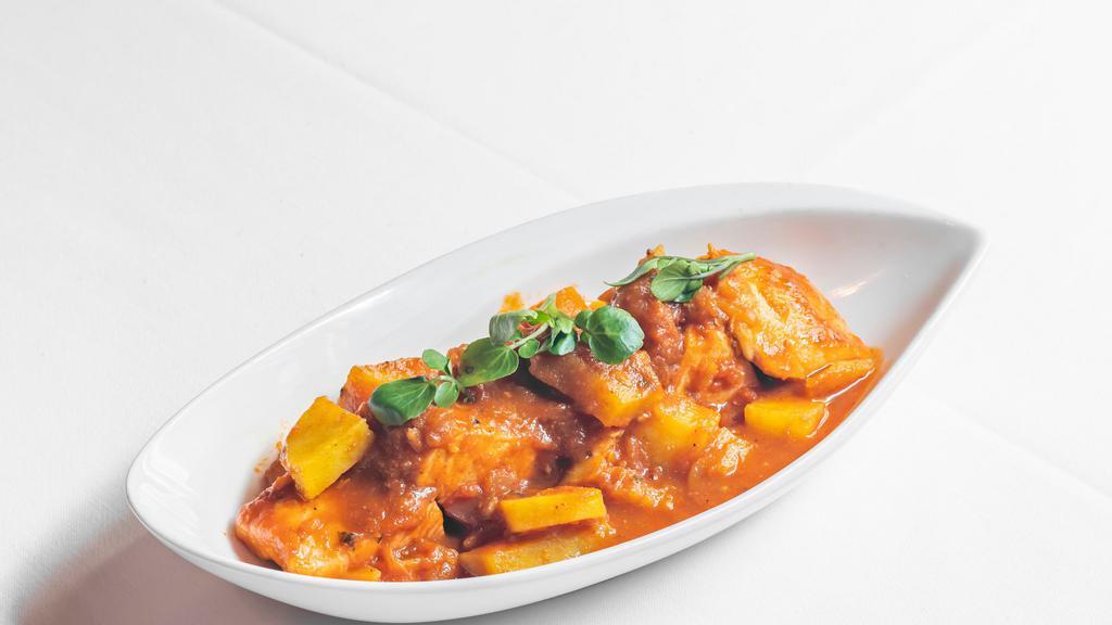 Salmon Vindaloo · Spicy Goan sauce with dry red chilies, garlic, and potatoes.