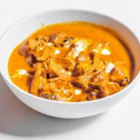 Murgh Makhani (Butter Chicken) · Boneless tandoori chicken cooked in mild creamy tomato sauce.