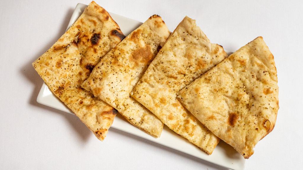Tandoori Cheese Naan · Stuffed with gruyere & paneer, sprinkled with za'atar spice.