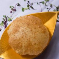 Poori · Traditional fried puffy bread.