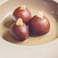 Gulab Jamun · Dried milk pastries in a honey, saffron and cardamom syrup.