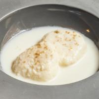 Rasmalai · Pressed indian cheese, reduced milk, rose-saffron cream sauce.