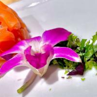 Salmon Tartare · Chopped salmon, tobiko, and onion with japanese dressing.