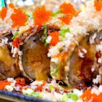 Godzilla Roll · Lightly fried cocktailed roll with spicy tuna, salmon, yellowtail, topped with masago, scall...