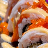 What A Roll · Spicy. Shrimp tempura with avocado topped with crab stick smelt roe and spicy mayo & hot Sauce