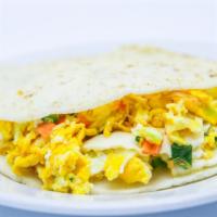 Arepa Rellena · Stuffed arepa with Colombian style eggs.