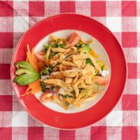 Mexican Fiesta Salad · Leaf lettuce tossed with lime-marinated grilled chicken breast, tomatoes, cheddar cheese, av...