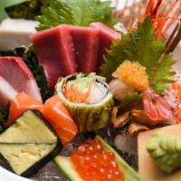Chirashi Deluxe · Assorted exotic raw fish on the bed of seasoned rice. Served with miso soup, salad, and rice.