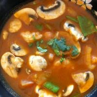 Fresh Tom Yum Soup · Medium spicy - Thai famous spicy and sour lemongrass soup with tomato, mushroom and snowpea