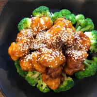 Sesame Chicken · Not Spicy - Fried chicken cubes sauteed with sesame seeds in brown sweet and tangy sauce, Am...