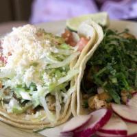 Tacos Con Camaron · Two pieces. Shrimp tacos, onions, cilantro, lettuce, tomato, sour cream and fresh cheese.