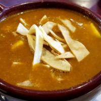 Corn Tortilla Soup · With Mexican style made with a tomato base, onions, garlic, fried tortilla, fresh cheese and...