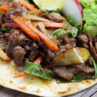3 Bulgogi Tacos · Korean style marinated steak, onions, carrots, scallions, romaine on flour tortilla.