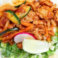 3 Spicy Pork Tacos · Korean style marinated pork in sweet and spicy gochujang sauce, onion, carrots, zucchinis, s...