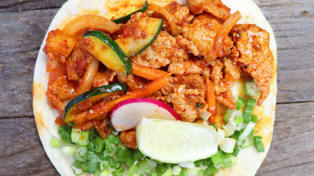 3 Spicy Pork Tacos · Korean style marinated pork in sweet and spicy gochujang sauce, onion, carrots, zucchinis, scallions on flour tortilla.