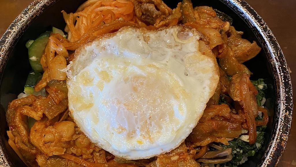 Bibim Bowl · Vegetarian. Korean bowl, white rice topped with prepared spinach, fern, bean sprout, carrot, zucchini, Portobello mushroom, pickled radish and over easy egg. Served with seasoned red pepper paste.
