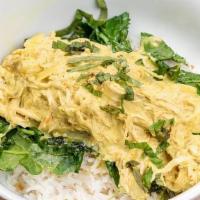 Chicken Curry · Slow Cooked Coconut Chicken, Green Curry Sauce, Spring Onions & Thai Basil Over Steamed Whit...