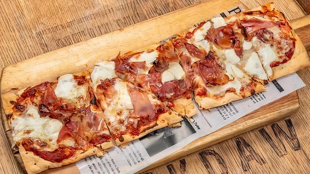 Sweet, Salty, Spicy Flatbread · Roasted Tomato Sauce, Prosciutto, Mozzarella Cheese + Fresh Garlic Drizzled With Mike's Hot Honey.
