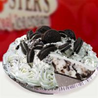 Oreo Ice Cream Pie · Oreo crust, topped with fudge, and filled with oreo ice cream.  Decorations may vary.
