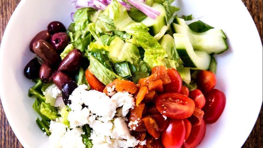 Greek Salad · Feta, olives, red onion, cherry tomato, romaine, cucumber, red peppers, oregano vinaigrette.