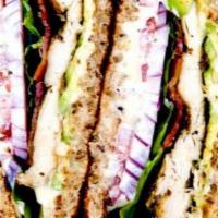 Chicken Club Sandwich · Multigrain Pullman, Avocado, Lettuce, Tomato, Onion and Hardwood Bacon, Garlic Aioli.