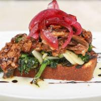 Pulled Duck Focaccia · Marinated and shredded duck breast on cornbread focaccia and broccoli rabe.