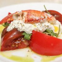 Lobster And Burrata Salad · Warm lobster tail, seasonal tomatoes, arugula, and burrata cheese