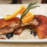 Duck  Confit 1/2 Duck · Slow-braised duck, Grand Marnier  and orange reduction served with blueberry barley risotto.