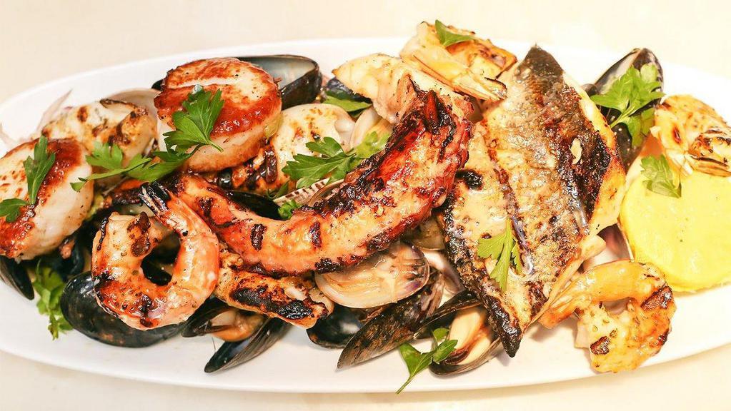Mixed Grilled Seafood (For Two Or More) · Scallops, shrimps, branzino fillet, calamari, salmon, octopus with mussels and clams.