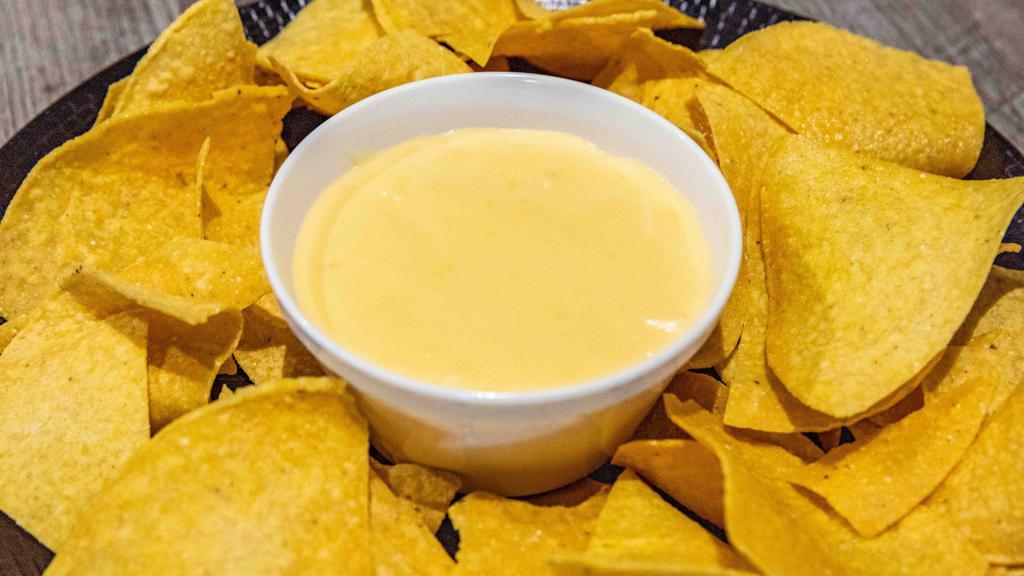 Queso & Chips · Homemade queso dip with 5 cheeses!