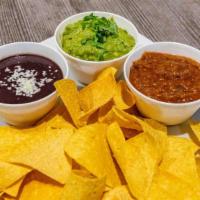 El Trio · Chips with homemade guacamole, salsa, and black beans.